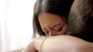 in this tightly framed shot, actors and real-life couple, Diana and Adrian Parks embrace for the cover of WITHOUT YOUR LOVE, short film from Canada